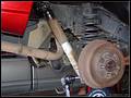 RE8003 Removing right rear shock.