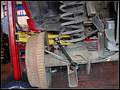 RE8003 Removing left rear sway bar link.