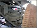 RE8003 Showing disconnected left rear sway bar link.