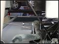 RE8003 Installing rear track bar to axle side bracket.