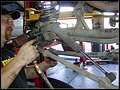 RE8003 Disconnecting axle side front track bar.